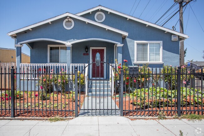 Renovated homes in Iron Triangle are getting new paint, new privacy fences, and new gardens.