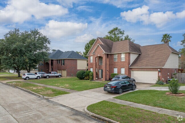 A row of brick homes sits along a quiet cul-de-sac in Highlands.