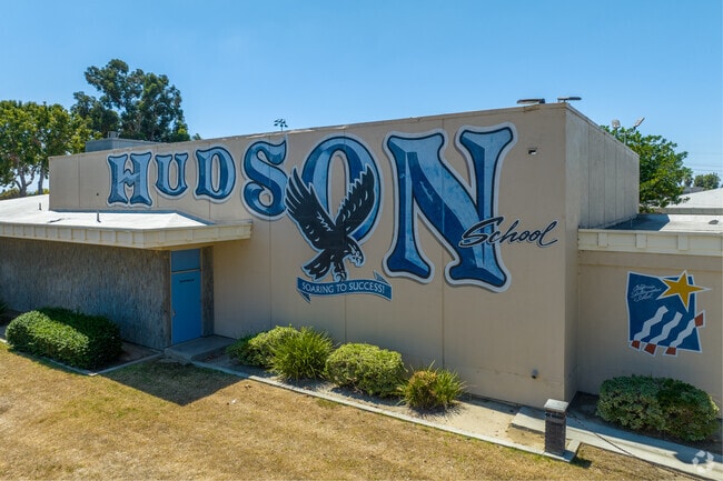 Hudson Elementary School has a side entrance with school graffiti.