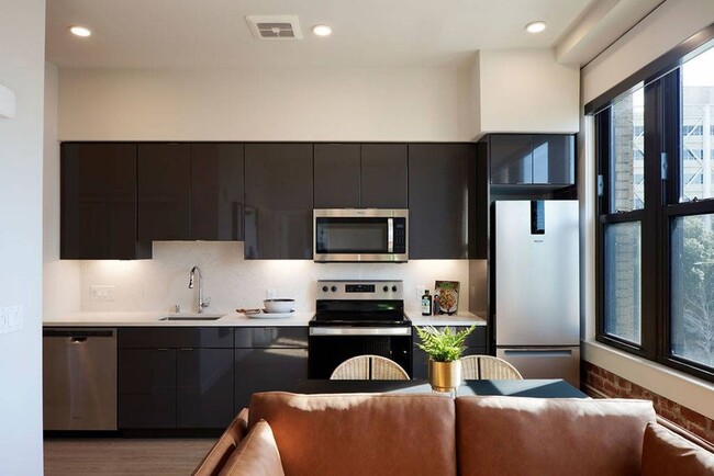 Thoughtful touches like undercabinet lighting, high gloss cabinets, oversized windows and roller shades combine to create an excellent living experience at Modera Berkeley.*