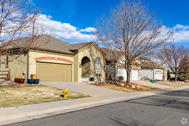 Rows of traditional single family homes with a modern twist sit on the lakefront in Grant Ranch.