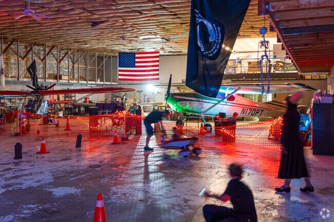Familes play many games at the Haunted Hangar Halloween Festival in Indian Chase Meadows.