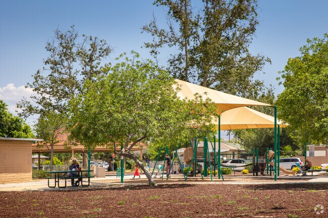Alessandro residents enjoy the trees and shaded play areas at Mistletoe Park.