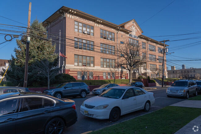 The Walter F. Robinson school is large and takes up the majority of the block its on.