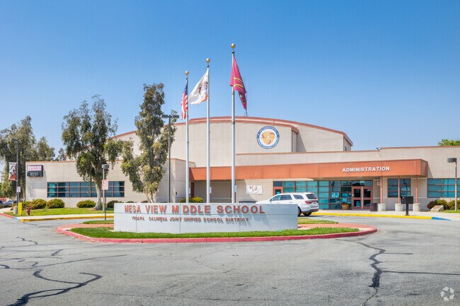 Flags hang high at the front entrance of Mesa View Middle School in Calimesa.