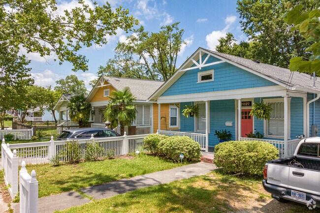 A row of historic cottages adds color to Carolina Place.