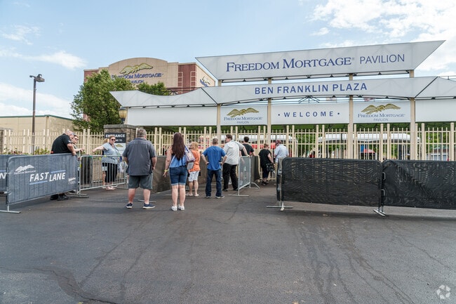 Music fans gather at the gates of the Freedom Mortgage Pavilion to see live music.