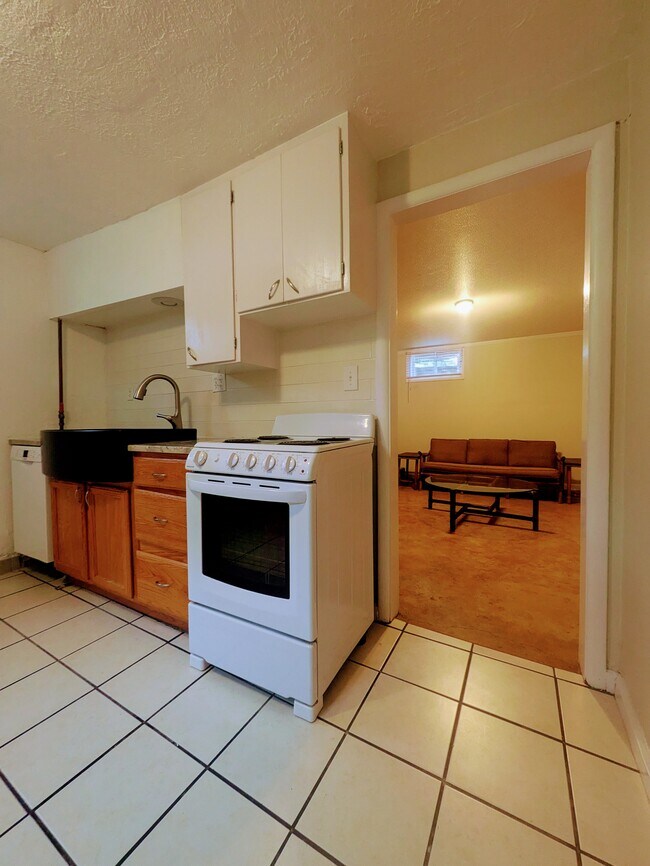 Updated kitchen includes dishwasher, granite counters