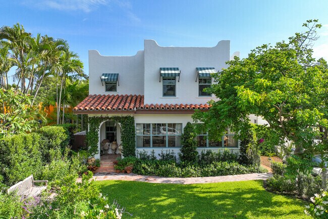 Mediterranean revival home with beautiful front garden in South End neighborhood.