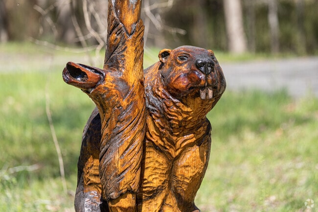 Wooden sculptures adorn the entrance to Cheltenham Wetland Park in Rosaryville.
