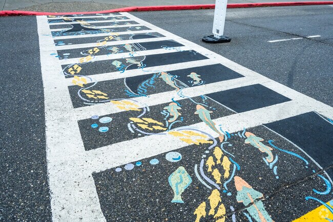 The pathway at Weller Elementary School depicts a whale among the ocean life.
