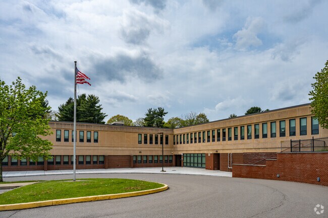 The American flag proudly flies on the grounds of J. H. Brooks Elementary School.