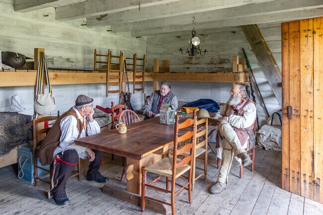 History aficionados gather and converse at the Fort Loudon Historic Site.