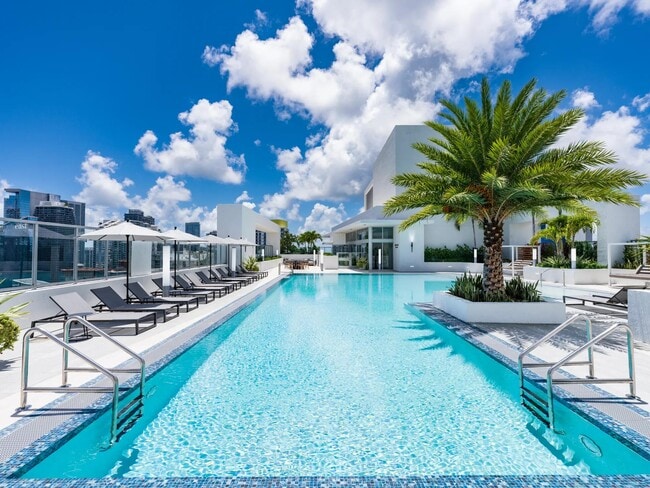 Dive into resort-style living at Modera Riverside’s rooftop pool surrounded by stunning Miami views.