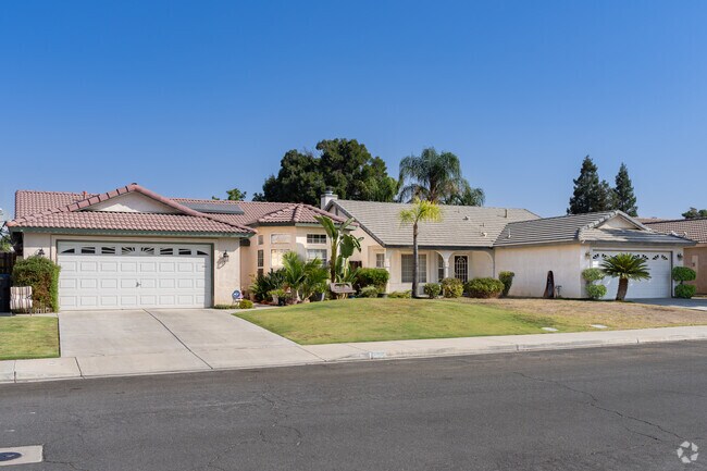 Two Spanish style inspired homes in North Country Meadows.