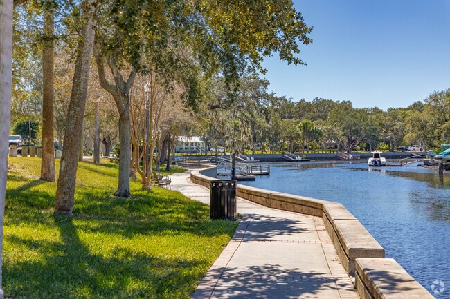 Locals can stroll along the sidewalk that runs beside the Cotee River.