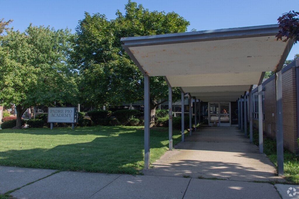 An entry shot for Padre Pio Academy.