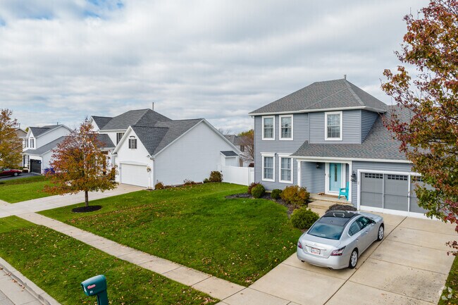Newer homes with multicar garages sit on tidy lawns in West Seneca.