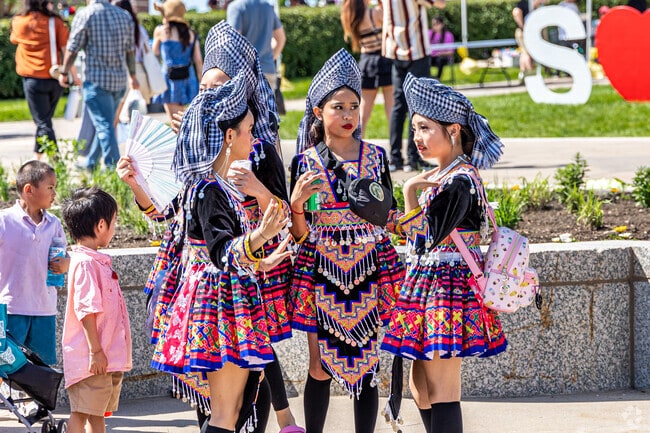 Performers prepare to showcase traditional dance during Songkran festivities.