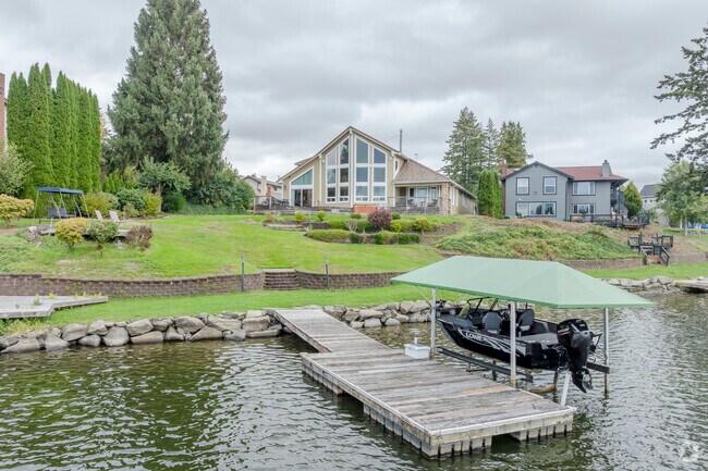 Many of the beach front properties offer a dock for the boat along Long Lake in Lacey area.