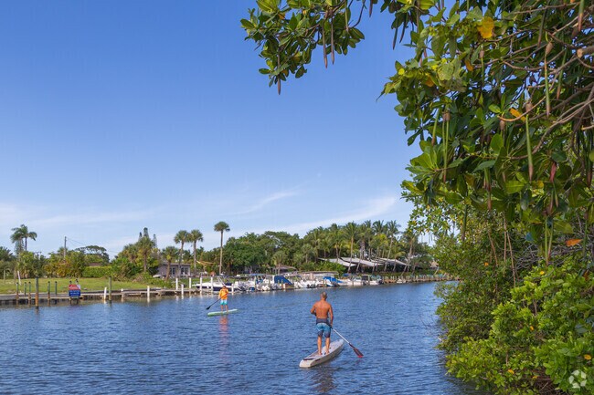 Locals love to navigate the Jupiter Town Hall neighborhood by water on paddleboards.