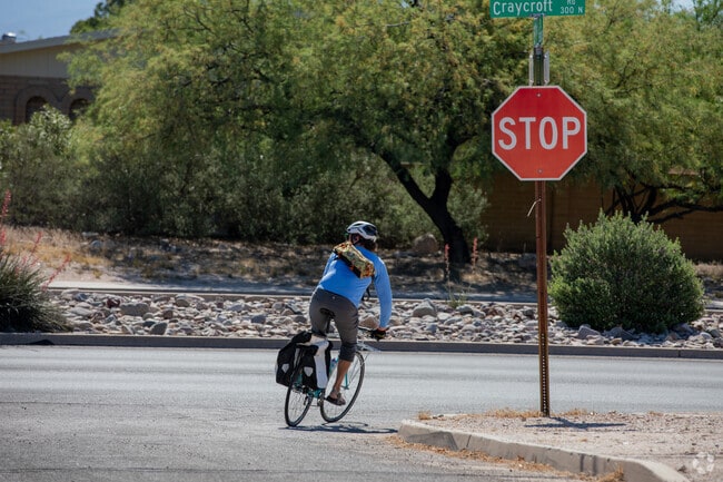 A bicyclist heads south on Craycroft Road from Highland Vista.