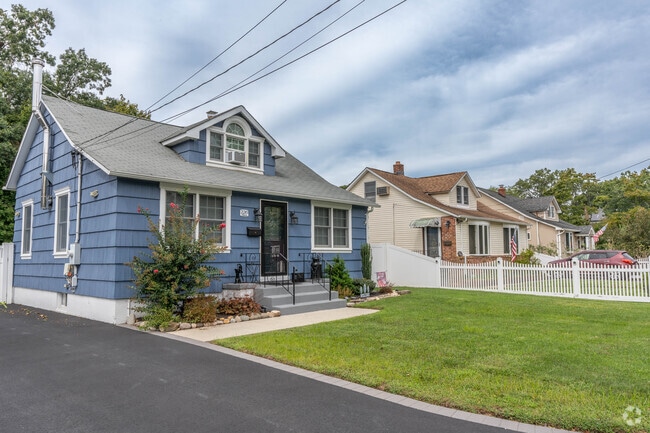 Colorful homes line quiet residential streets in Islip Terrace.