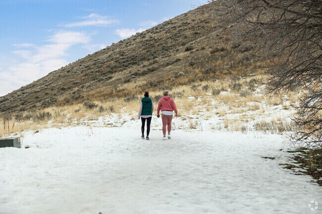 Women hike in the snow in the East Bench neighborhood.