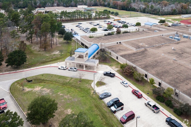Parents line up to wait for their children to finish school at Brabham Middle School.