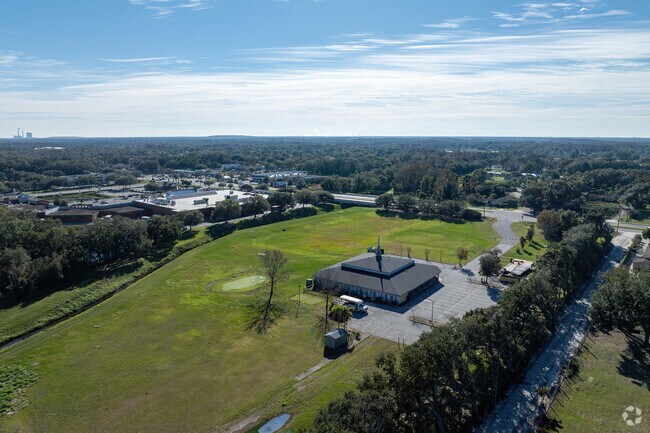 A large tree line offers privacy for students at New Beginnings Academy.