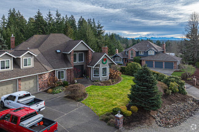 These lovely homes sit close to farmland and lush forested roads in Atkinson.