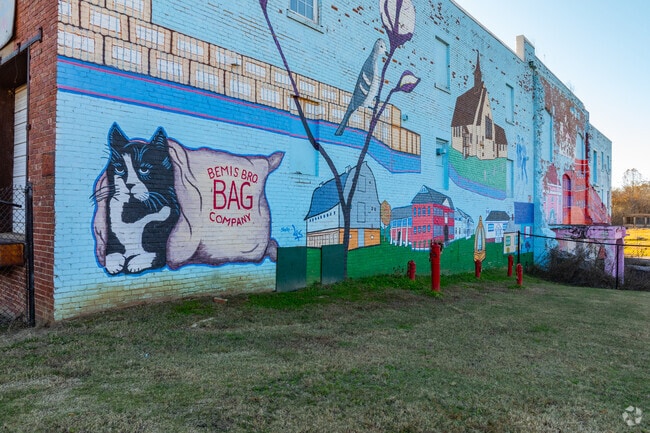 The history of Historic Downtown Bemis is painted on the side of the old Bemis factory.