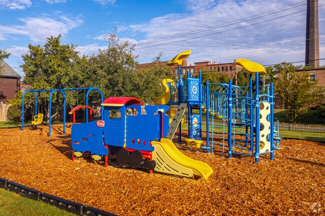 The Botanical Heights neighborhood playground has train engine for kids to play on.