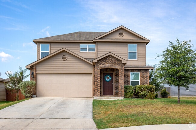 Traditional homes big garages are located in Elmendorf.