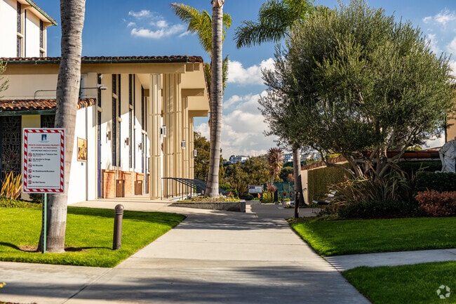 A paved walkway leads to the entrance of St. Lawrence Martyr School in Redondo Beach.