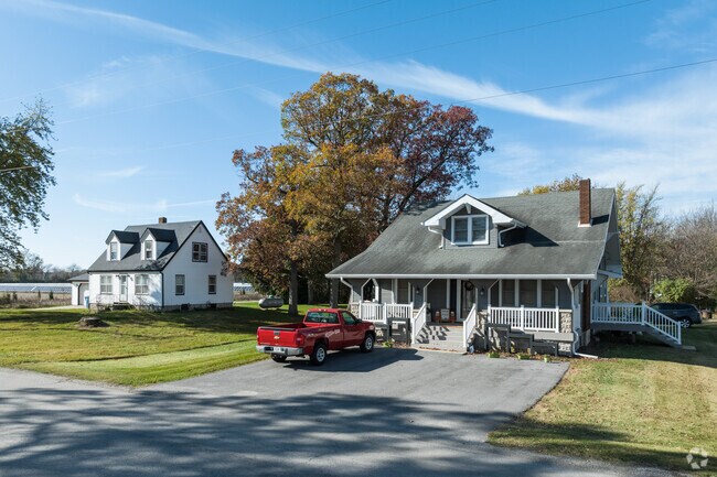 A newer home sits next to a Cap Cod inspired home in Kankakee.