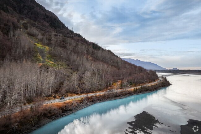 Alaska roads feature Chugach Range views near Butte neighborhoods.