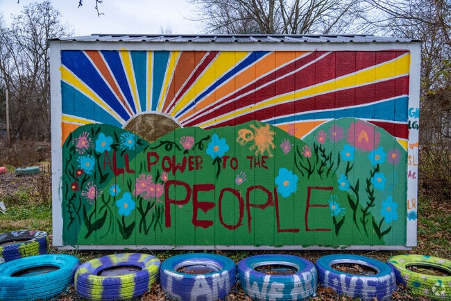 A mural decorates a shed in a community garden in Southeast Warren.