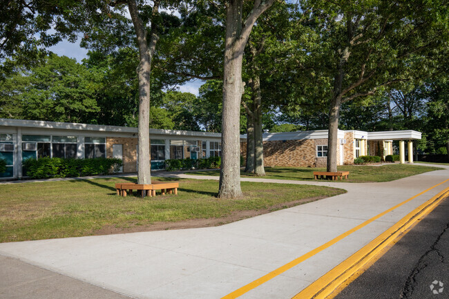 Nokomis School great little benches under the trees out front.