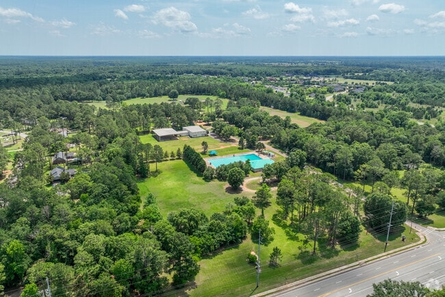The YMCA Sports Complex in Westwood offers a 50-meter outdoor pool, picnic tables, lounge chairs, and various sports facilities including soccer fields, baseball fields, and a playground.