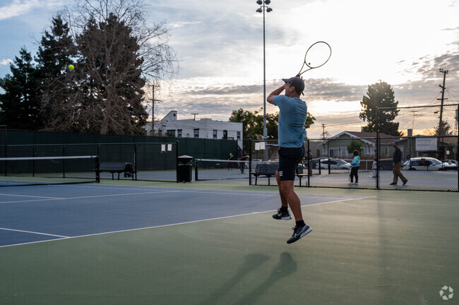 Golden Gate residents play a round of tennis.