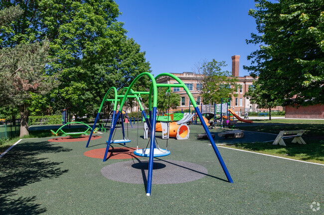 The playground at the Atwater School is bold and vibrant with multiple activities.