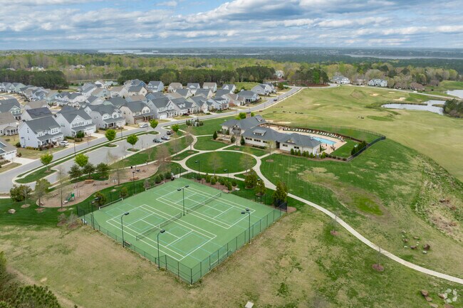 There are pickleball & tennis courts and a playground as well near the clubhouse for Legacy at Jordan Lake residents to enjoy.