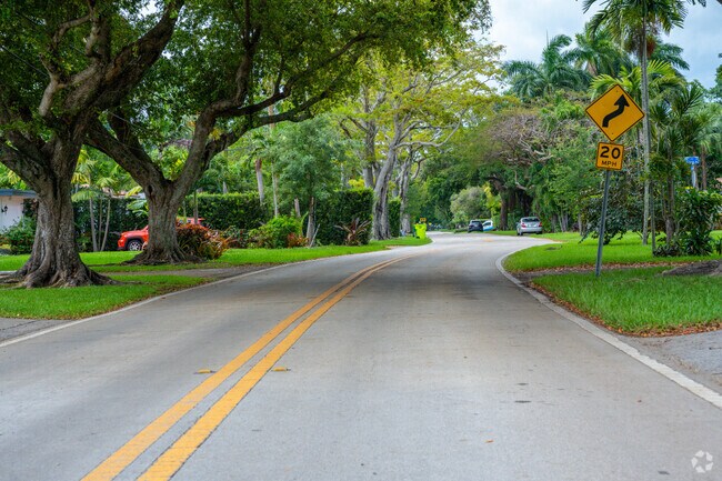 Residential street in the heart of El Portal with larger homes.