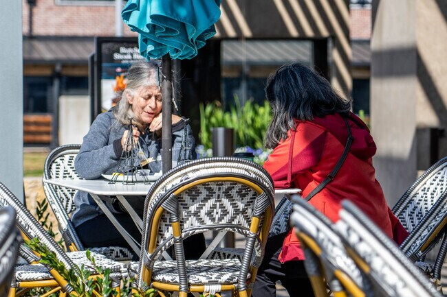 Visitors to Baybrook Mall in Friendswood enjoy lunch on an outside patio.