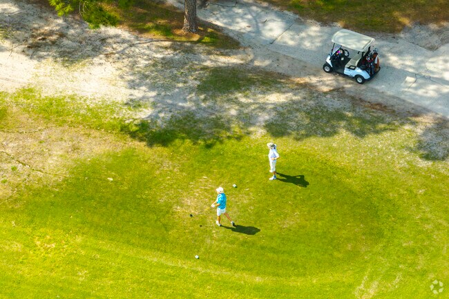 Grab a cart and hit the links at The Country Club at Silver Spring Shores.