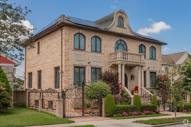 Manicured lawns are the norm in Flushing Heights.