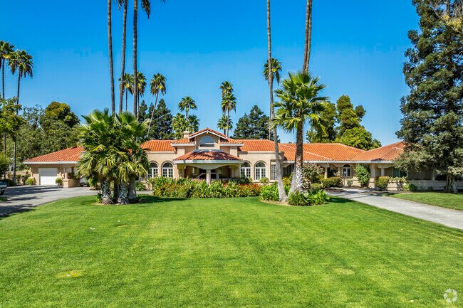 This larger upscale home in Yuba City has stucco siding and a clay tile roof.