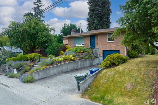 A brick home with a garage on NE 175th St in Westhill.