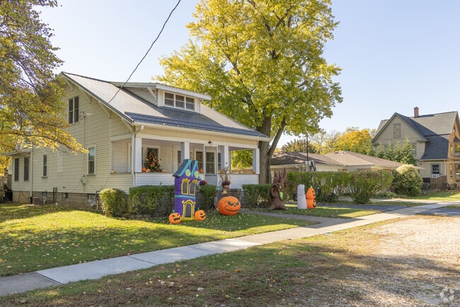A bungalow sits on a quiet street with seasonal decorations in Somonauk.